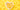 A white heart-shaped bowel filled with fish oil supplements sitting on a yellow background.