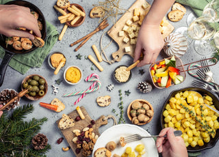 Top down view of a table full of holiday food.