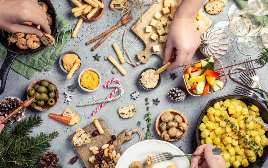 Top down view of a table full of holiday food.