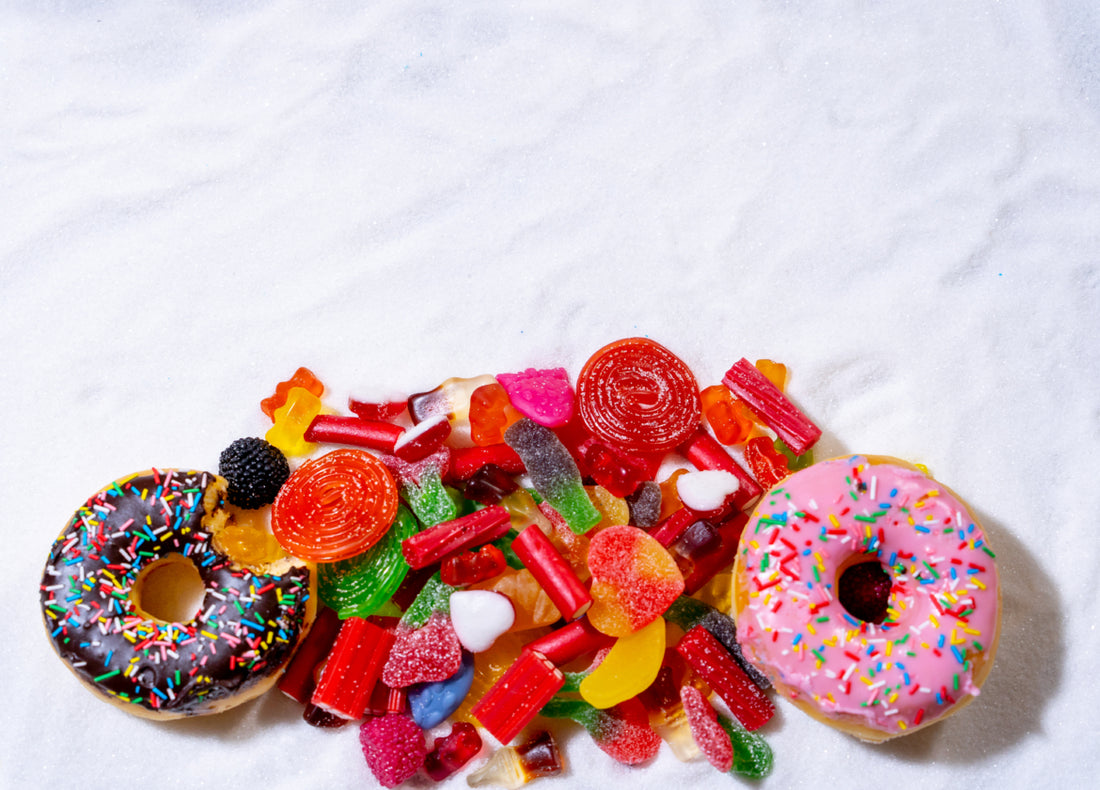 A pile of sugar-filled treats including donuts and candy.
