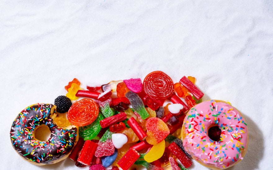 A pile of sugar-filled treats including donuts and candy.