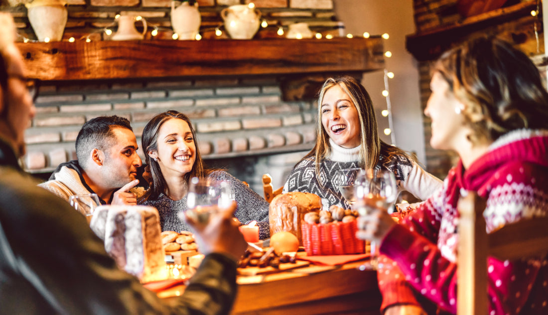 Group of young adults enjoying a holiday meal together. 